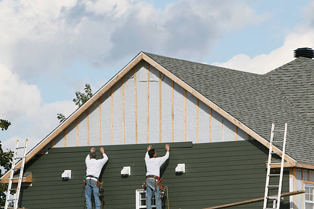 Professional Storm Damage Siding Repair technician working in Bethany, WV